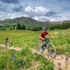 A modern family of bikers, riding on bicycles in Crested Butte, Colorado.